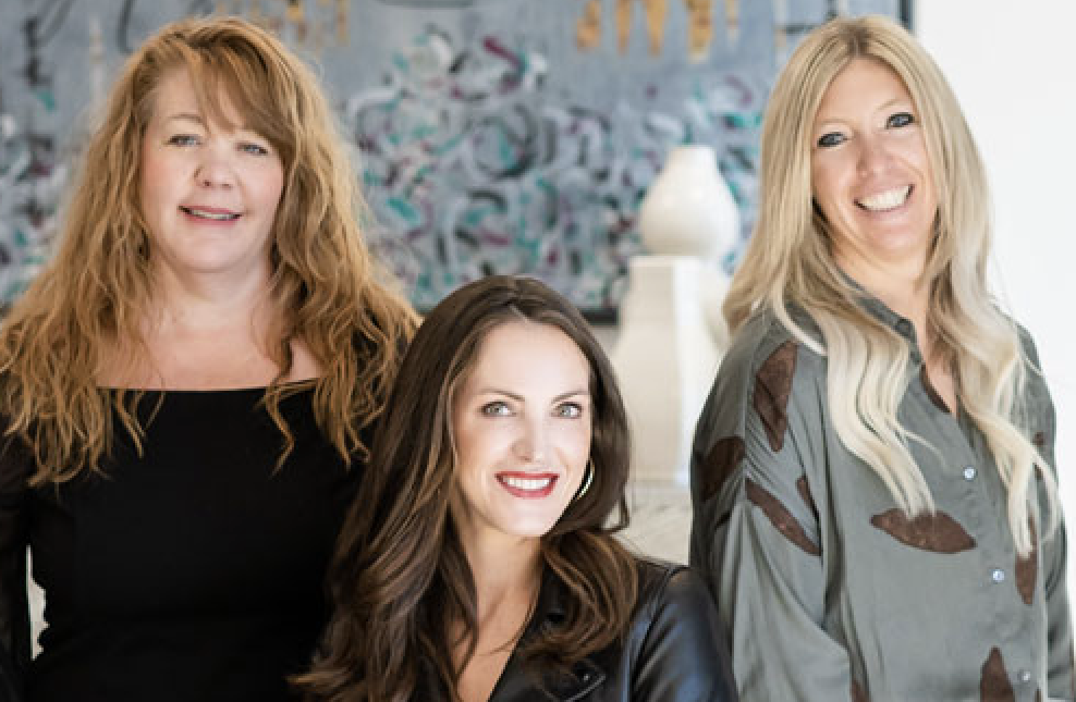 A photo of three women that make up the Versatile Design team